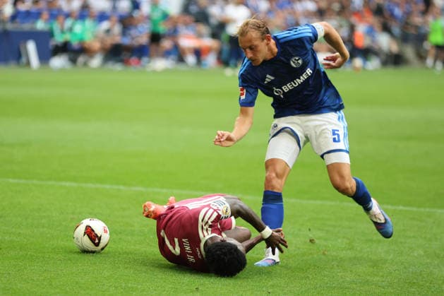 Vinicius Junior of Real Madrid and Timo Becker of FC Schalke 04 during the exhibition match between FC Schalke 04 and Real Madrid CF. Copyright Thomas Pakusch Copyright: Thomas Pakusch