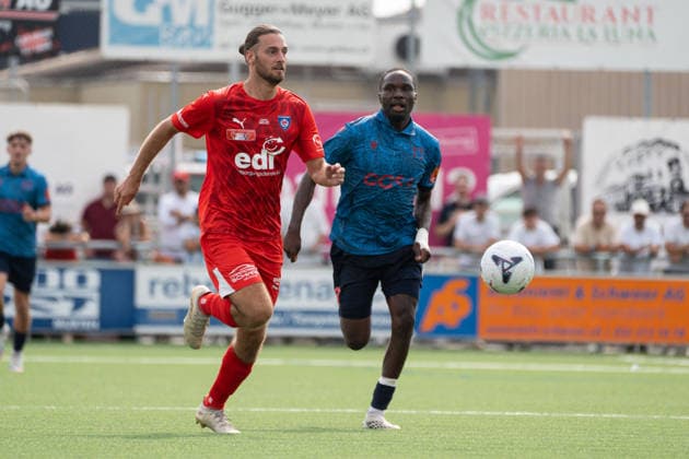 KERZERS, FRIBOURG, SWITZERLAND - AUGUST 16: Enea Rostetter of FC Kerzers challenges Josias Lukembila of FC Sion during the Swiss Cup first round match between FC Kerzers and FC Sion at Stadion Erli on August 16, 2026 in Kerzers, Fribourg, Switzerland. Copyright: xLivioxBaeriswylx xSPPx Sportspressphoto_SPR209020