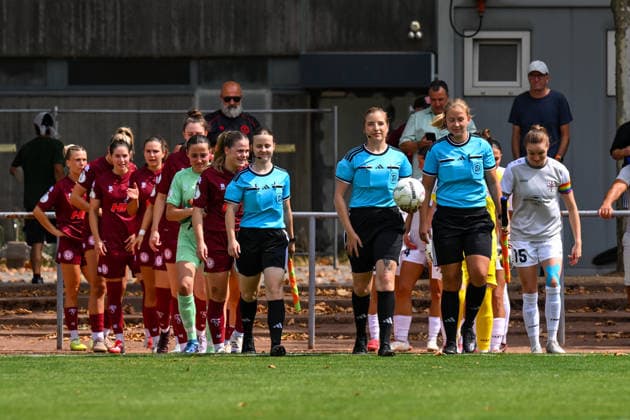 August 16, 2026, Soccer, 2026–2027 DFB Women s Cup Playoffs, Fortuna Cologne vs. SG 99 Andernach. Both teams and the referees take the field.