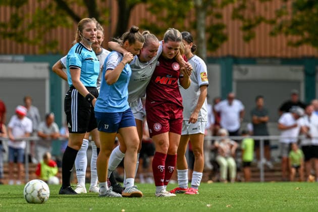 August 16, 2026, Soccer, 2026–2027 DFB Women’s Cup Playoffs, Fortuna Cologne vs. SG 99 Andernach: Paula Petri of Andernach is injured and is carried off the field by Andernach’s physical therapist and her former Cologne teammate Anna Grassinger