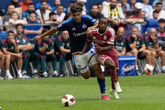 Gelsenkirchen, Germany, August 16, 2026, Mertcan Ayhan of FC Schalke 04 and Yan Diomande in a tackle during the friendly match between FC Schalke 04 and Real Madrid at the Veltins Arena in Gelsenkirchen. Photo by Joachim Bywaletz. DFB and DFL regulations prohibit any use of photographs as iIMAGE SEQUENCES AND OR QUASI-VIDEO Copyright: JoachimxBywaletz xJB-Sportfoto