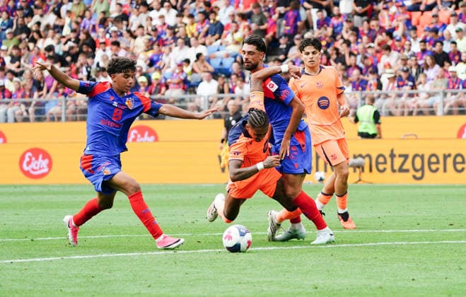 August 16, 2026, Switzerland, Basel, St. Jakob Park, Men s Soccer, 2026–2027 Season, Friendly Match: FC Basel vs. FC Barcelona, 2–5, Photo by Raphinta: FC Barcelona vs. Jean Doucoure and Nicolas Vouilloz, Re: FC Basel, Action