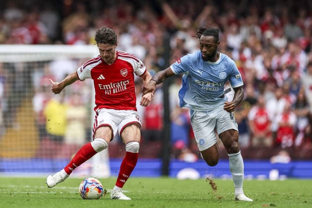 CARDIFF, WALES, AUG 16: Antoine Semenyo of Manchester City and Declan Rice of Arsenal fight for possession during the FA Community Shield match between Arsenal and Manchester City at the Millennium Stadium in Cardiff, Wales on 16th of August (photo by Qian Jun Sports Press Photo) Copyright: xQianxJun SportsxPressxPhotox Sportspressphoto_SPR209555