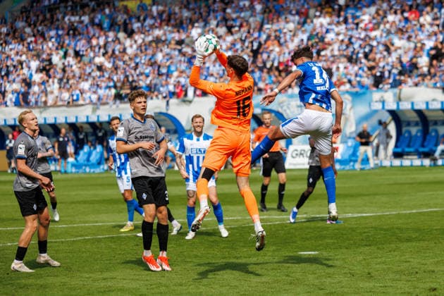 from left: Julian Rieckmann (Waldhof), Moritz Polte (Waldhof), Jan Niemann (Waldhof), and Lukas Wallner (Rostock, GER); FC Hansa Rostock vs. SV Waldhof Mannheim; Soccer; Men; 3rd Division; Matchday 2; 2026–2027 Season; August 16, 2026, Rostock Ostseestadion, Mecklenburg-Western Pomerania, Germany