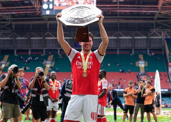 Cardiff, Wales, 16th August 2026. Declan Rice of Arsenal is hit in the face as he lifts the FA Community Shield trophy following the Arsenal vs Manchester City FA Community Shield match at Principality Stadium, Cardiff. Picture credit should read: Cody Froggatt Sportimage EDITORIAL USE ONLY. No use with unauthorised audio, video, data, fixture lists, club league logos or live services. Online in-match use limited to 120 images, no video emulation. No use in betting, games or single club league player publications. SPI_244_CF_ARSENAL_V_MANCHESTER_CITY SPI-4912-0244