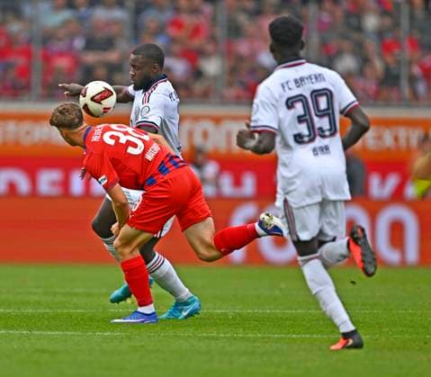 August 18, 2026, 2026–2027 Bundesliga, Friendly Match, 1. FC Heidenheim vs. FC Bayern Munich, at the Voith Arena in Heidenheim; from left: Yannik Wagner of 1. FC Heidenheim beats Dayot Upamecano of FC Bayern Munich