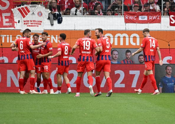 August 18, 2026, xsltx, soccer friendly, 1 FC Heidenheim vs. FC Bayern Munich: Yannik Wagner (1 FC Heidenheim 1846 2) scores the 1–0 goal and is celebrated by the team. DFL and DFB regulations prohibit any use of photographs as image sequences and or quasi-VVIDEO
