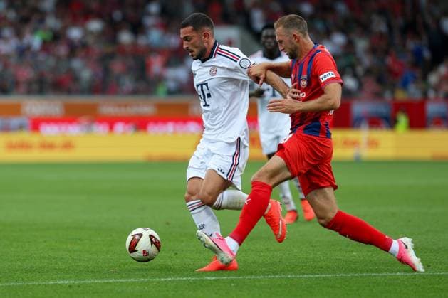 In a one-on-one duel, in action, with Arijon Ibrahimovic, 22, FC Bayern Munich, Jonas Foehrenbach 19, 1 FC Heidenheim, 1 FC Heidenheim 1846 vs. FC Bayern Munich, soccer, friendly match, August 18, 2026, Heidenheim, Baden-Württemberg, Germany Copyright: xkolbert-press ChristianxKolbertx