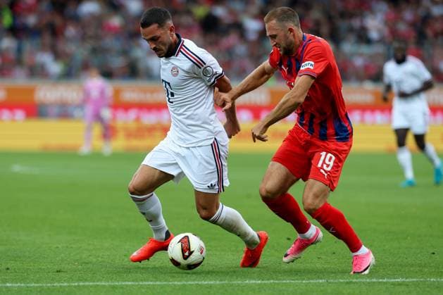In a one-on-one duel, in action, with Arijon Ibrahimovic, 22, FC Bayern Munich, Jonas Foehrenbach 19, 1 FC Heidenheim, 1 FC Heidenheim 1846 vs. FC Bayern Munich, soccer, friendly match, August 18, 2026, Heidenheim, Baden-Württemberg, Germany Copyright: xkolbert-press ChristianxKolbertx