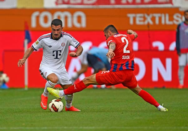August 18, 2026, 2026–2027 Bundesliga, Friendly Match, 1. FC Heidenheim vs. FC Bayern Munich, at the Voith Arena in Heidenheim; from left: Arijon Ibrahimovic (FC Bayern Munich) vs. Marnon Busch (1. FC Heidenheim 1846)