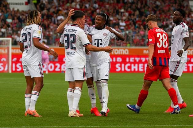 FC Bayern Munich celebrates a goal after Felipe Chavez (No. 32, FC Bayern Munich) scores the 1-1 equalizer, with Wisdom Mike (No. 36, FC Bayern Munich) and Sascha Boey (No. 23, FC Bayern Munich), 1 FC Heidenheim 1846 vs. FC Bayern Munich, soccer, men’s, Bundesliga, friendly match, 2026–2027 season, August 18, 2026. DFB regulations prohibit any use of photographs as image sequences and or quasi-video. Heidenheim, Baden-Württemberg, Germany Copyright: xkolbert-press MartinxAgüerax