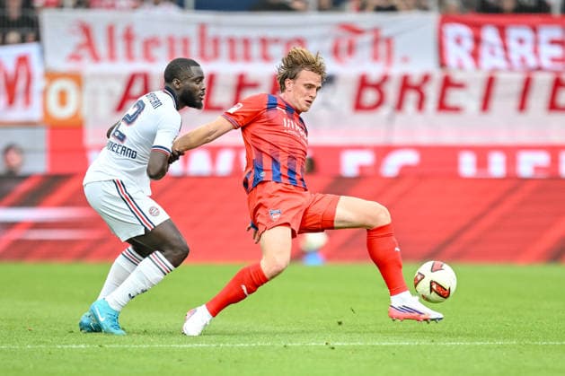 Dayot Upamecano of FC Bayern Munich and Mikkel Kaufmann of 1 FC Heidenheim 1846 battle for the ball during the preseason friendly match between 1 FC Heidenheim and FC Bayern Munich at the Voith Arena on August 18, 2026 in Heidenheim, Germany. Photo by Harry Langer, DeFodi Images