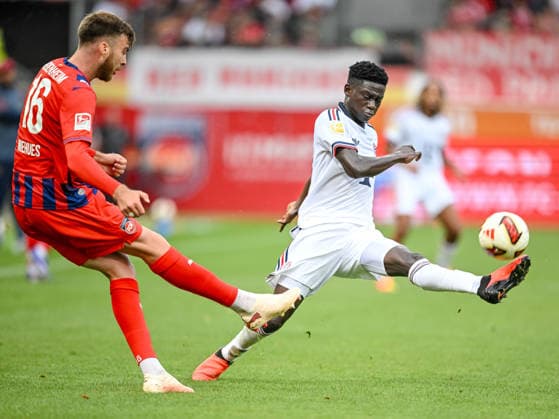 Julian Niehues of 1 FC Heidenheim 1846 and Bara Ndiaye of FC Bayern Munich battle for the ball during the preseason friendly match between 1 FC Heidenheim and FC Bayern Munich at the Voith Arena on August 18, 2026 in Heidenheim, Germany. Photo by Harry Langer, DeFodi Images
