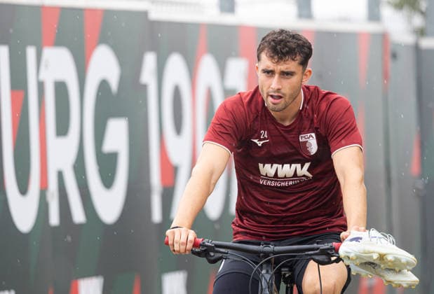 Thomas Kastanaras of FC Augsburg 24 on his way to the FC Augsburg training field by bike, training,