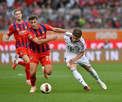 Tackle, Tim Binder, FC Bayern Munich (FCB) 46 vs. Luca Kerber, 1 FC Heidenheim 1846 (FCH) 20. 1 FC Heidenheim 1846 (FCH) vs. FC Bayern Munich (FCB) Friendly Match August 18, 2026. DFL REGULREGULATIONS PROHIBIT ANY USE OF PHOTOGRAPHS AS IMAGE SEQUENCES AND OR QUASI-VIDEO 1 FC Heidenheim 1846 FCH vs. FC Bayern Munich FCB FRIENDLY MATCH