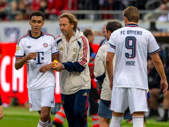 August 18, 2026, 2026–2027 Bundesliga season, friendly match, 1. FC Heidenheim vs. FC Bayern Munich, at the Voith Arena in Heidenheim; after collapsing again during the game, Jamal Musiala of Bayern Munich is treated by team doctor Prof. Dr. Peter Ueblacker and led off the field