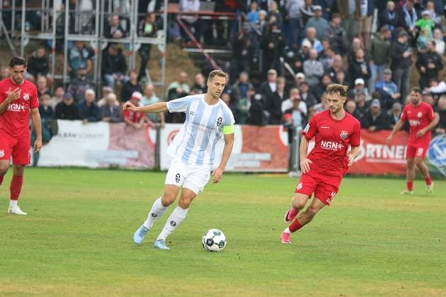 August 18, 2026, Soccer, Men s, 2026–2027 Season, Bavarian Regional League, TSV Aubstadt vs. 1860 Munich Löwen: Captain Dennis Dressel vs. Aubstadt s Fabio Bozesan