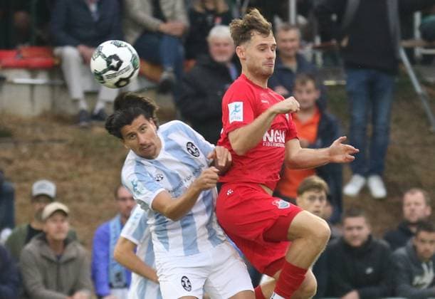 August 18, 2026, Soccer, Men s, 2026–2027 Season, Bavarian Regional League, TSV Aubstadt vs. 1860 Munich: Aerial duel between the Lions Tunay Denis (left) and Aubstadt s Fabio Bozesan