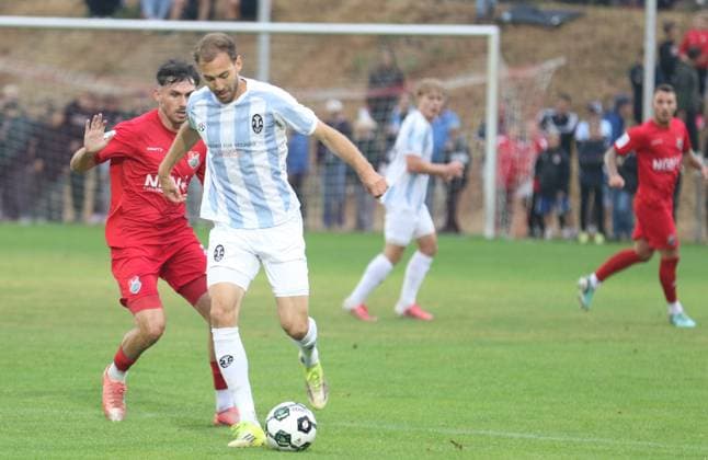 August 18, 2026, Soccer, Men s, 2026–2027 Season, Bavarian Regional League, TSV Aubstadt vs. 1860 Munich: Aubstadt s Pascal Moll (left) against 1860 Munich s Michael Eberwein