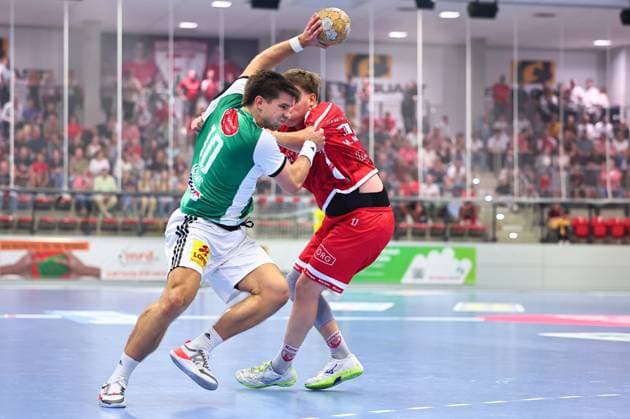 Renars Uscins (TSV Hannover Burgdorf), No. 10, in a one-on-one battle with Mattis Michel (TuS Ferndorf), No. 17, GER, TuS Ferndorf vs. TSV Hannover Burgdorf, Handball, DHB Cup, 1st Round, 2026–2027 Season, August 21, 2026 GER, TuS Ferndorf vs. TSV Hannover Burgdorf, Handball, DHB Cup, Round 1, 2026–2027 season, August 21, 2026 Kreuztal Copyright: xEibner-Pressefoto RenexWeissx EP_RWS
