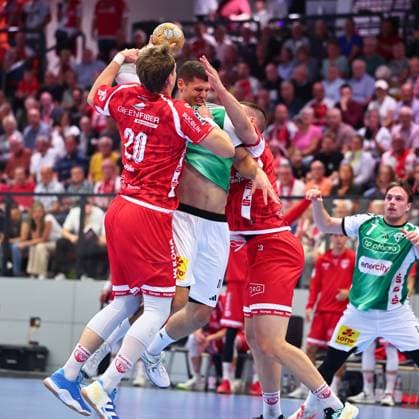 Sebastian Heymann (TSV Hannover Burgdorf), No. 11, in a one-on-one battle with Philip Wuerz (TuS Ferndorf), No. 20, on the left, and Fabian Hecker (TuS Ferndorf), No. 29 (GER), TuS Ferndorf vs. TSV Hannover Burgdorf, Handball, DHB Cup, Round 1, 2026–2027 season, August 21, 2026, Germany; TuS Ferndorf vs. TSV Hannover Burgdorf, Handball, DHB Cup, 1st Round, 2026–2027 season, August 21, 2026, Kreuztal Copyright: xEibner-Pressefoto RenexWeissx EP_RWS