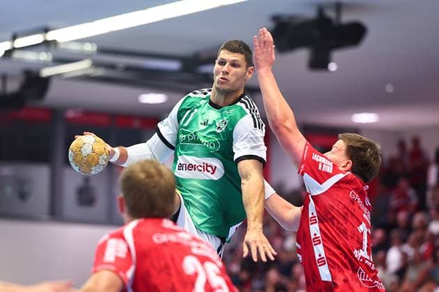 Sebastian Heymann (TSV Hannover Burgdorf), No. 11, in a one-on-one battle with Mattis Michel (TuS Ferndorf), No. 17, Germany, TuS Ferndorf vs. TSV Hannover Burgdorf, Handball, DHB Cup, 1st Round, 2026–2027 Season, August 21, 2026 GER, TuS Ferndorf vs. TSV Hannover Burgdorf, handball, DHB Cup, Round 1, 2026–2027 season, August 21, 2026 Kreuztal Copyright: xEibner-Pressefoto RenexWeissx EP_RWS