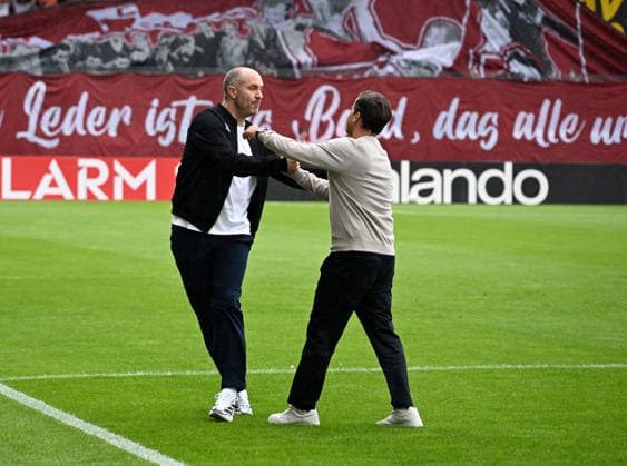 2026-27 DFB Cup, First Round, Wiesbaden, BRITA Arena: SV Wehen Wiesbaden vs. Bayer Leverkusen, 0-4. Coach Rotation: Coach Daniel SCHERNING of SV Wehen Wiesbaden (left) and Coach Carlos MARTINEZ of Bayer Leverkusen. DFB Cup