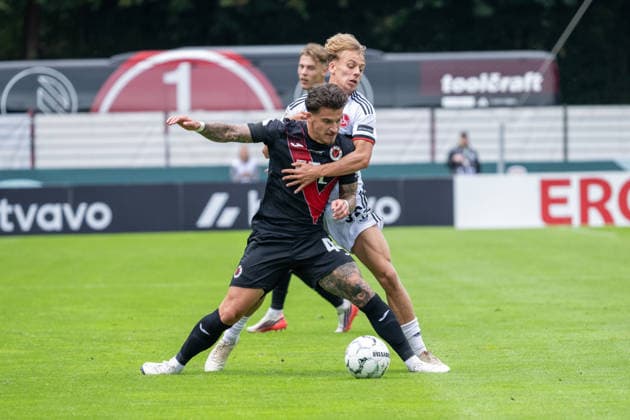 Tackle between Niklas Castelle of Viktoria Cologne, 44, and Tim Janisch of 1. FC Nuremberg, 32; Viktoria Cologne vs. 1. FC Nuremberg, Soccer, DFB Cup, First Round, 2026–2027 Season, August 22, 2026 DFL DFB regulations prohibit any use of photographs as image sequences and or quasi-video Viktoria Cologne vs. 1. FC Nuremberg, soccer, DFB Cup, 1st round, 2026–2027 season, August 22, 2026, Cologne Copyright: xEibner-Pressefoto ThomasxHaeslerx EP_THR