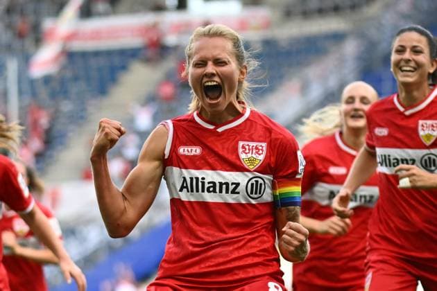Chantal Hagel raises both fists in the air and lets out a shout of joy, while her VfB Stuttgart teammates celebrate behind her. The scene captures raw emotion after a goal at the SNP Arena in Sinsheim. Chantal Hagel of VfB Stuttgart celebrates wildly after scoring a goal. Copyright: xMichaelxGelhardtx