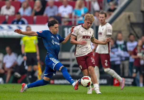August 30, 2026, 2026–2027 Bundesliga, Matchday 1, FC Augsburg vs. FC Schalke 04, at the WWK Arena in Augsburg; from left: Soufiane El Faouzi (FC Schalke 04) and Hennes Behrens (FC Augsburg)