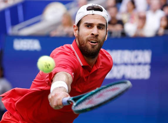 Karen Khachanov hits a backhand return to Alexander Zverev of Germany during the second set of the Men s semifinals in Arthur Ashe Stadium at the 2026 US Open Tennis Championship at the USTA Billie Jean King National Tennis Center in New York City on Friday, September 11, 2026.  NYP20260911819 JOHNxANGELILLO