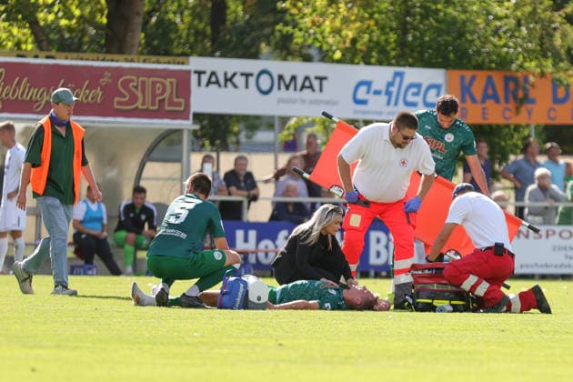 September 12, 2026, Soccer, Men s, Bavarian Regional League, 2026–2027 Season, Matchday 8: VfB Eichstätt vs. FC Schweinfurt 05. Injured VfB Eichstätt player Daniel Hofrichter (No. 8) is being treated on the field by medical staff at Hirsch Sportpark in Eichstätt, Bavaria, Germany