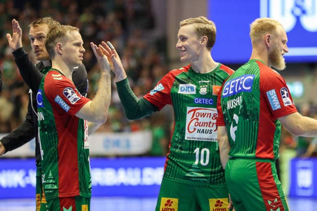 September 13, 2026, xgox, Handball Opel HBL SC Magdeburg vs. HSG Wetzlar emspor, from left: Omar Ingi Magnusson (Magdeburg), 14, Gisli Thorgeir Kristjansson (Magdeburg), 10, celebrating the victory, Celebrations after the game in Magdeburg