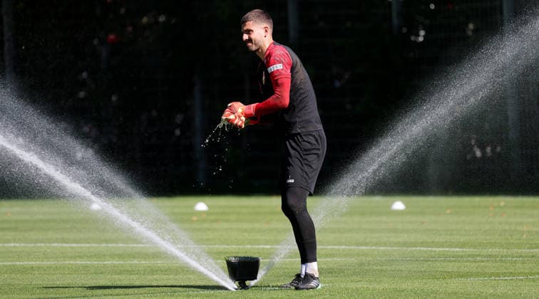 September 15, 2026, Germany, Stuttgart, VfB Stuttgart soccer practice, Fabian Bredlow wets his goalkeeper gloves