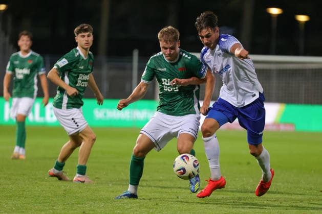 September 15, 2026, Soccer, Men s, 2026–2027 Season, Bavarian Regional League, Matchday 9: FC Schweinfurt 05 vs. FV Illertissen. From left: Gil Ebner (FC Schweinfurt 05, No. 8) in a duel with Eduard Hackmann (FV Illertissen, No. 23). Schweinfurt, Riedel Bau Arena at Sachs Stadium, Bavaria, Lower Franconia, Germany