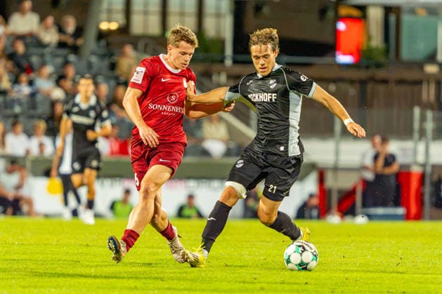 3rd Division: SG Sonnenhof Großaspach vs. Sportclub Verl, September 15, 2026, Aspach, GERMANY. September 15, 2026. Christian Mistl, SG Sonnenhof Großaspach, 6 in a tackle with Mika Clausen of Sportclub Verl, 21, during the match between SG Sonnenhof Großaspach and Sportclub Verl on Matchday 6 of the 3rd League at the WIRmachenDRUCK Arena Copyright: xBEAUTIFULxSPORTS Steinx