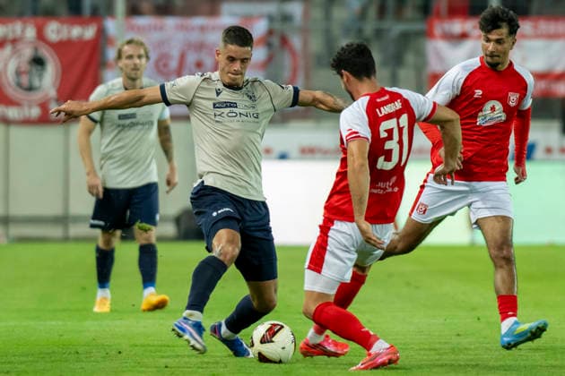 Regionalliga Northeast, Season 26-27: Hallescher FC vs. FC Carl Zeiss Jena, Halle, Germany, September 15, 2026. Pictured, from left, in a tackle: Luca Wollschlaeger (Jena) and Niklas Landgraf (Halle), Halle Saale Leuna Chemie Stadium, Saxony-Anhalt, Germany