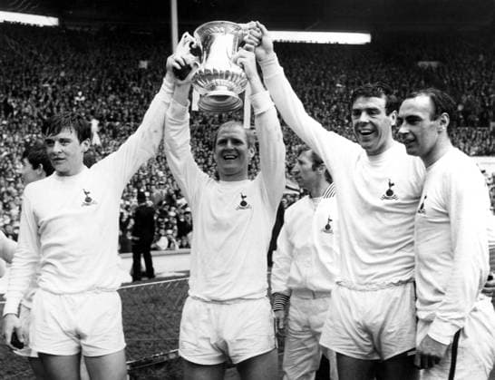 20th May 1967. 1967 FA Cup Final Tottenham Hotspur v Chelsea .Parading the cup after the match at Wembley Stadium: (l-r) Cyril Knowles, Frank Saul, Mike England, and Alan Gilzean. Spurs beat Chelsea 2-1 to lift the cup again. TALKINGxSPORT