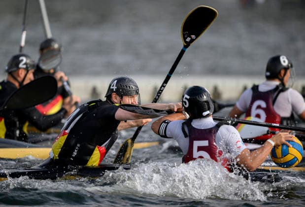 l r KMIEC, JEREMY GER battles KIMURA, RYOTA (JPN) for the ball; action; men s match: Germany vs. Japan 7–0, on September 16, 2026, at the Canoe Polo World Championships held from September 15 to September 20, 2026, at the Regatta Course in Duisburg, Germany