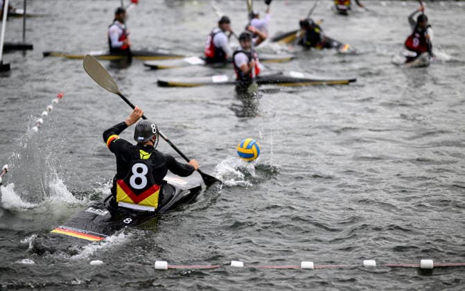 VIEREN, JONAS GER plays the ball; action; game scene: Men s Germany vs. Japan 7–0, on September 16, 2026, at the Canoe Polo World Championships held from September 15 to September 20, 2026, at the Duisburg Regatta Course in Germany