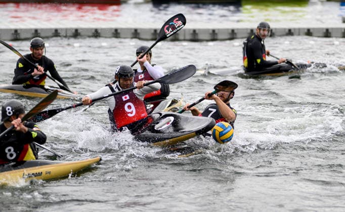 KIRCHHOFF, RENE (GER) in a battle with MIYAWAKI, HIMINE JPN, action, one-on-one, game play—men’s Germany vs. Japan 7–0, on September 16, 2026, at the Canoe Polo World Championships held from September 15 to September 20, 2026, in Duisburg, Germany, at the Regatta Course