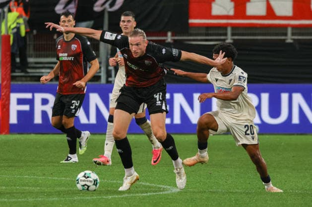 Vinko Sapina of FC Ingolstadt 04, No. 41, gets the better of Tiago Poller of TSG Hoffenheim II, No. 20, during the match between FC Ingolstadt 04 and TSG Hoffenheim II on September 16, 2026, DFB regulations prohibit any use of photographs as image sequences and or quasi-video. GER, Soccer, 3. Liga, Matchday 6, FC Ingolstadt 04 vs. TSG Hoffenheim II, September 16, 2026, Audi Sportpark Ingolstadt Copyright: xEibner-Pressefoto OliverxSTRISCHx EP-OSH