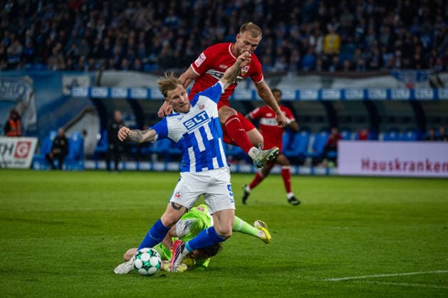 Rostock, Germany, September 16, 2026, 3. Liga 2026–2027, Matchday 6: FC Hansa Rostock vs. VfB Stuttgart II. Pictured, from left: Goalkeeper Jerik von der Felsen of VfB Stuttgart II fouls Andreas Voglsammer of Hansa Rostock in the penalty area, 11m DFB and DFL regulations prohibit any use of photographs as image sequences and or quasi-video Copyright: xFotostandx xVoelkerx