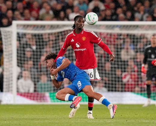 Manchester, England, 16th September 2026. Charalampos Kostoulas of Brighton and Ayden Heaven of Manchester United, ManU during the Manchester United vs Brighton and Hove Albion Carabao Cup match at Old Trafford, Manchester. Picture credit should read: Andrew Yates Sportimage EDITORIAL USE ONLY. No use with unauthorised audio, video, data, fixture lists, club league logos or live services. Online in-match use limited to 120 images, no video emulation. No use in betting, games or single club league player publications. SPI_014_AY_MAN_UTD_BRIGHTON SPI-5001-0014