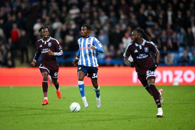 Coventry, England, 16th September 2026. Yann Gboho of Coventry City runs with the ball under pressure during the Coventry City vs Aston Villa Carabao Cup match at the Coventry Building Society Arena, Coventry. Picture credit should read: Harriet Massey Sportimage EDITORIAL USE ONLY. No use with unauthorised audio, video, data, fixture lists, club league logos or live services. Online in-match use limited to 120 images, no video emulation. No use in betting, games or single club league player publications. SPI_065_HM_COV_v_Villa_160926 SPI-5000-0056