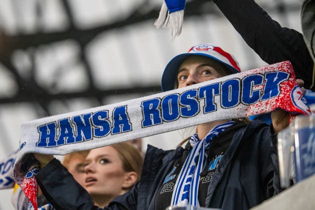 Rostock, Germany, September 16, 2026; 3rd Division 2026–2027, Matchday 6: FC Hansa Rostock vs. VfB Stuttgart II. Pictured: A Hansa Rostock fan wearing a scarf. DFB and DFL regulations prohibit any use of photographs as image sequences and or quasi-video. Copyright: xFotostandx xVoelkerx