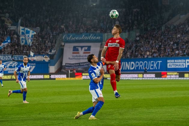 Rostock, Germany, September 16, 2026, 3rd League 2026–2027, Matchday 6: FC Hansa Rostock vs. VfB Stuttgart II. Pictured from left, in a tackle: Marco Schuster (Hansa Rostock) and Veit Stange (VfB Stuttgart II). DFB and DFL regulations prohibit any use of photographs as image sequences and or quasi-video Copyright: xFotostandx xVoelkerx