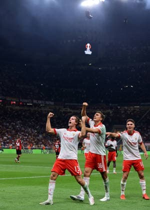 AC Milan v Benfica - UEFA Europa League - Season 2026-2027 Milan, Italy, 16th September 2026. Jakub Kaminski of SL Benfica celebrates with team mates Georgiy Sudakov and Joao Palhinha after scoring to give the side a 2-0 lead during the AC Milan vs SL Benfica UEFA Europa League, League Phase match at Giuseppe Meazza, Milan. Picture credit should read: Jonathan Moscrop Milan Stadio Giuseppe Meazza Italy