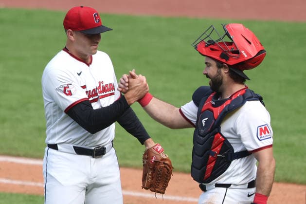 Cleveland Guardians Cade Smith (36) shakes hands with catcher Austin Hedges (27) after defeating the Chicago White Sox 6-3 at Progressive Field in Cleveland, Ohio on Wednesday, September 16, 2026.  CLE20260916111 AARONxJOSEFCZYK