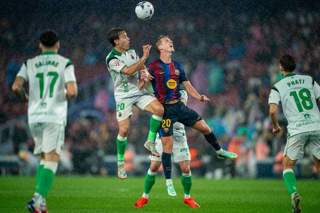 (260917) -- BARCELONA, Sept. 17, 2026 -- FC Barcelona, Barca s Dani Olmo (top R) vies for a header with Racing Santander s Sergio Canales during the La Liga football match between FC Barcelona and Racing Santander in Barcelona, Spain, on Sept. 16, 2026. (Photo by Xinhua) (SP)SPAIN-BARCELONA-FOOTBALL-LA LIGA-BARCELONA VS RACING SANTANDER JoanxGosa 